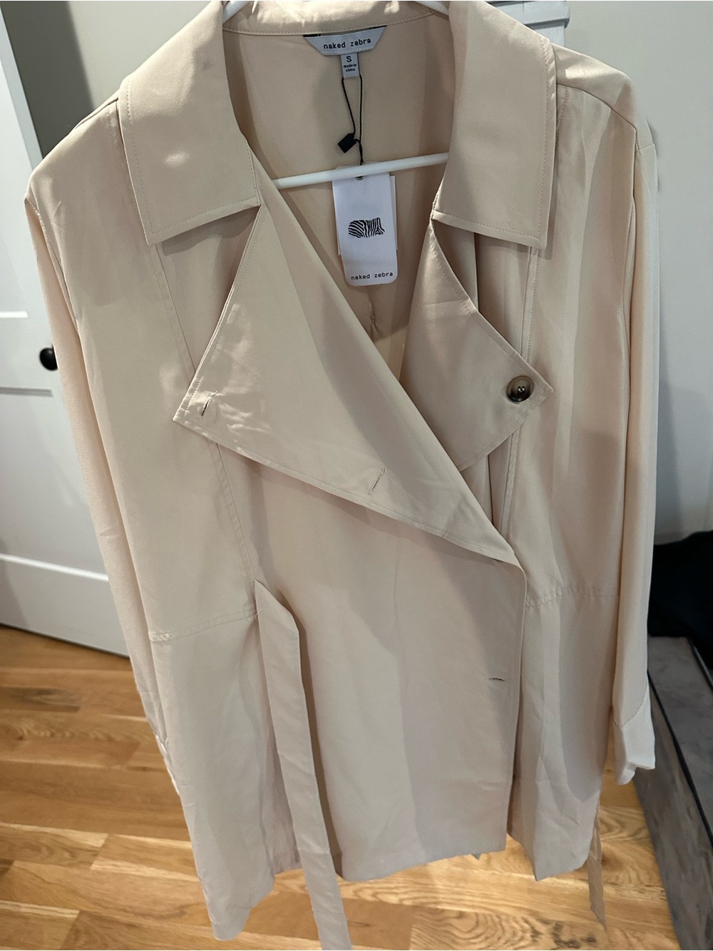 Naked Zebra soft cream trench coat with draped lapel